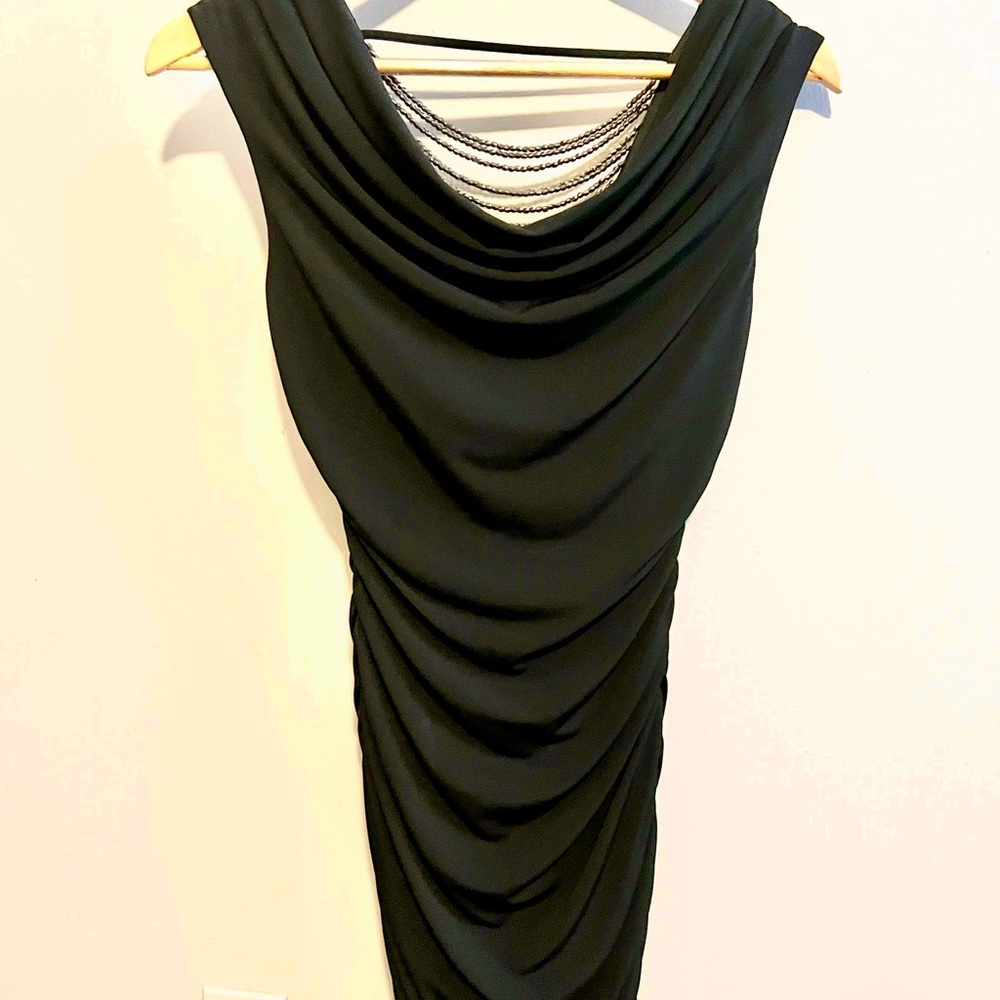 Elegant Black Draped Dress with embellished back.